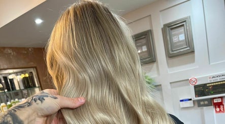 Chic hairstyle with golden waves at The Hair Cabin, Cambridge, England, GB.