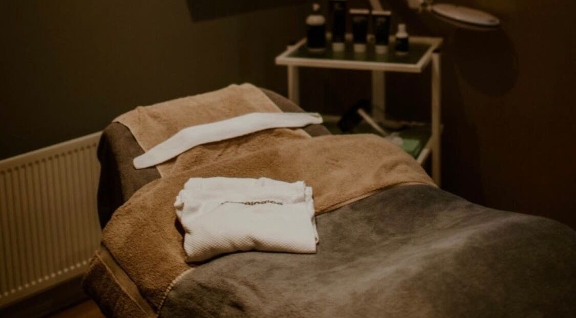 Cozy spa bed at Victoria's Health and Beauty, Lurgan, Northern Ireland, GB, with soft towels and tranquil ambiance.