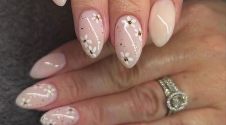 Elegant floral nail design at Victoria's Health and Beauty in Lurgan, Northern Ireland, GB featuring delicate patterns.