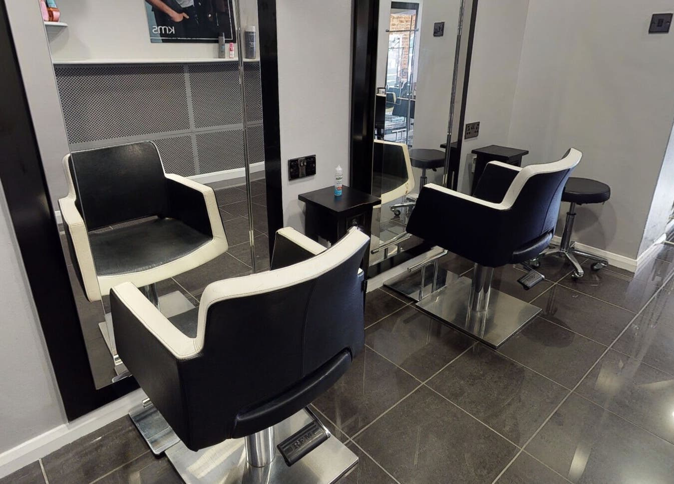 Modern salon chairs and mirrors at Jonathan Ditton salons, Emsworth, England, GB for a luxurious experience.