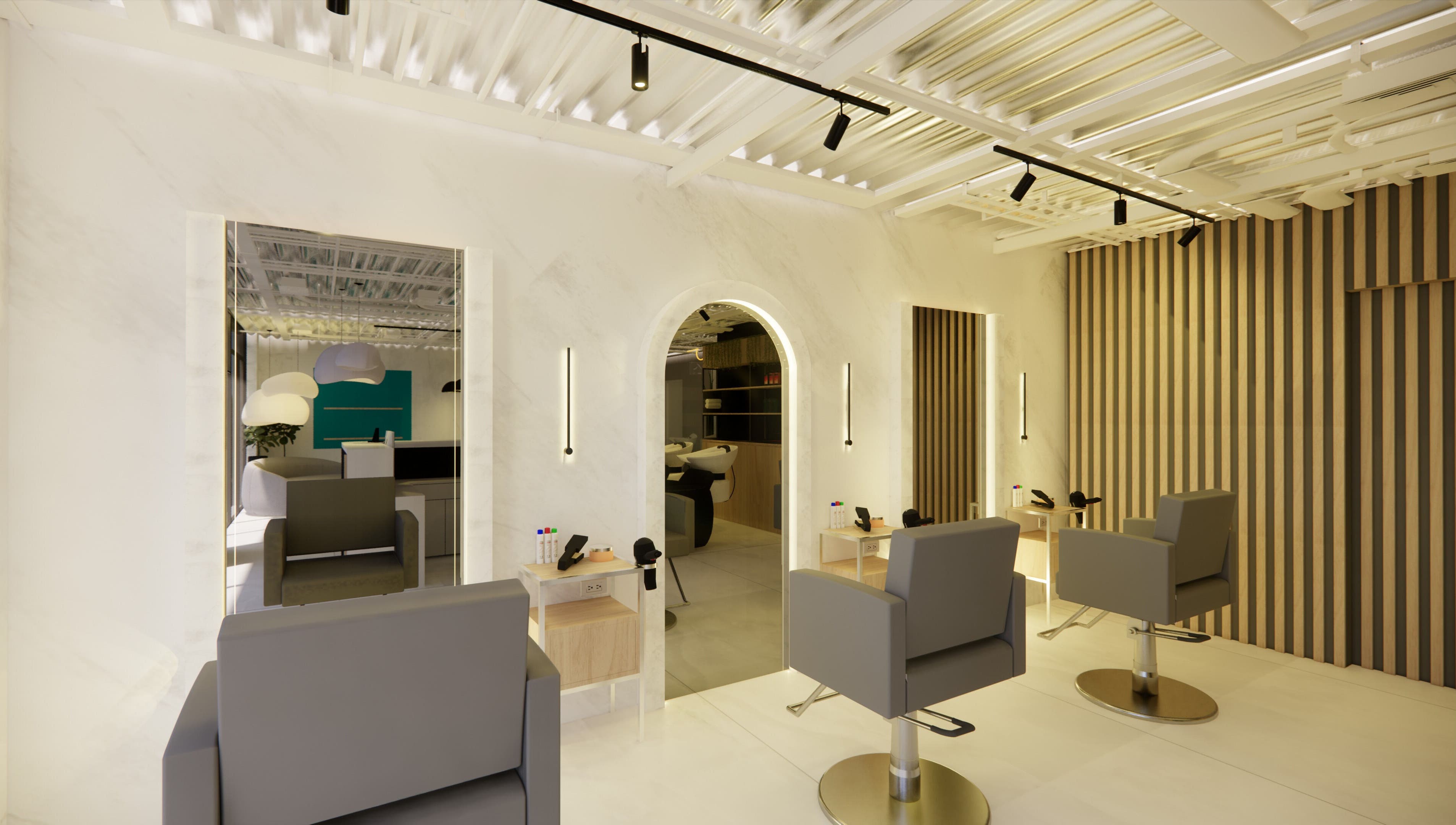 Interior moderno en Brushed Beauty Bar Cumbayá, Quito, Pichincha, EC, con sillas de peluquería y espejos iluminados.