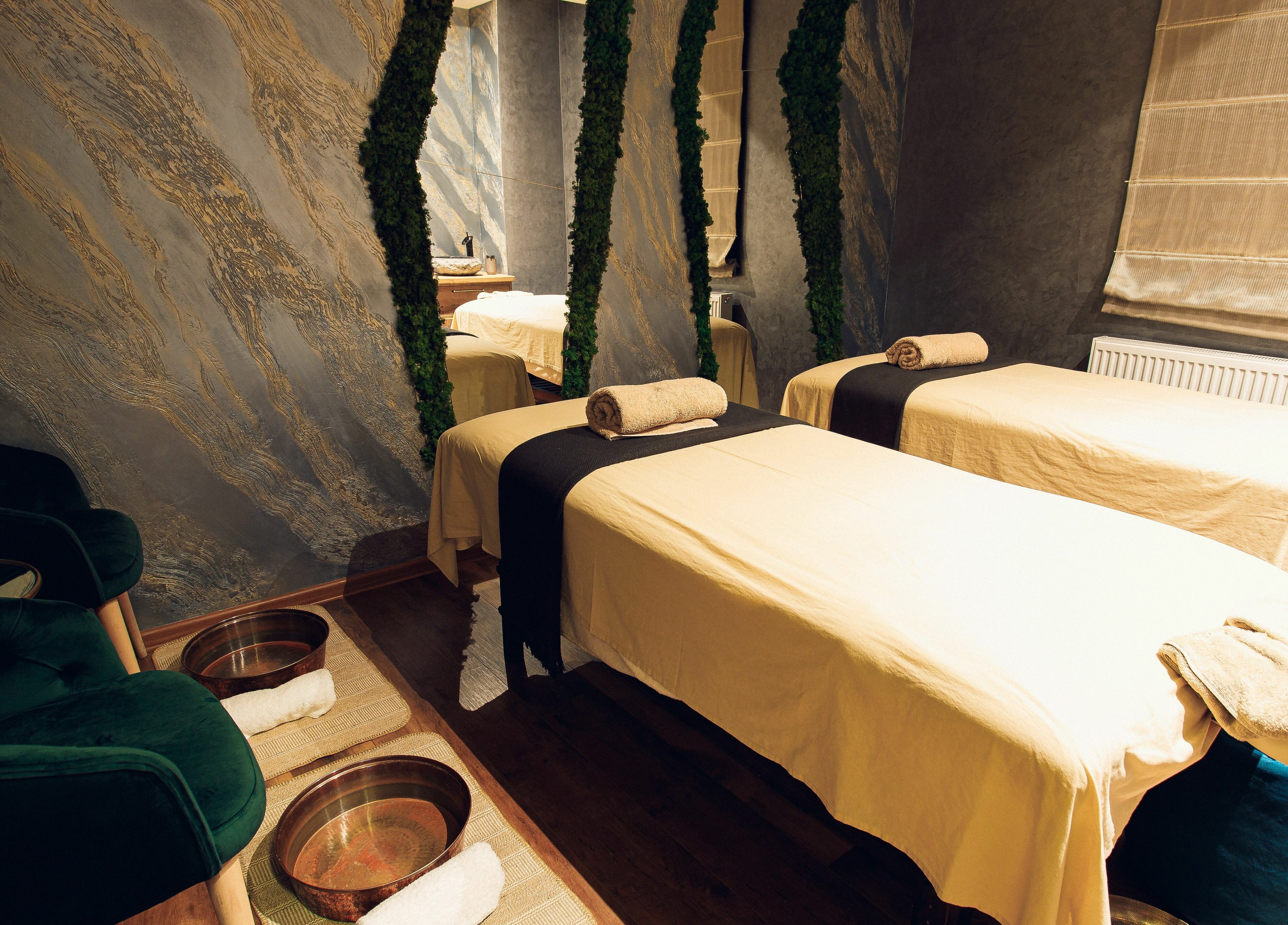 Relaxing treatment room at Adara Spa, București, București, RO, featuring two massage tables and elegant decor.