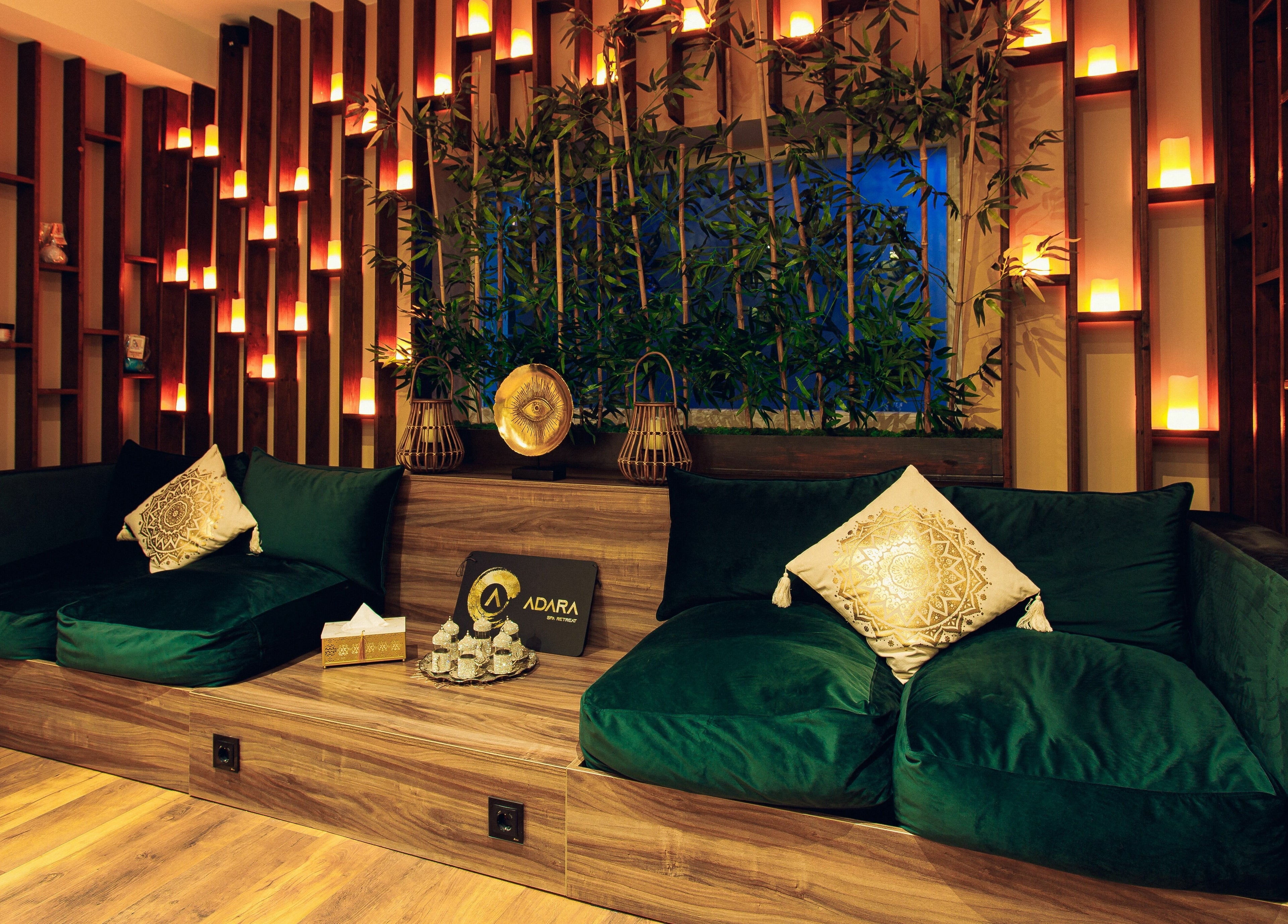 Elegant lounge area at Adara Spa, București, RO, with plush seating and ambient lighting.