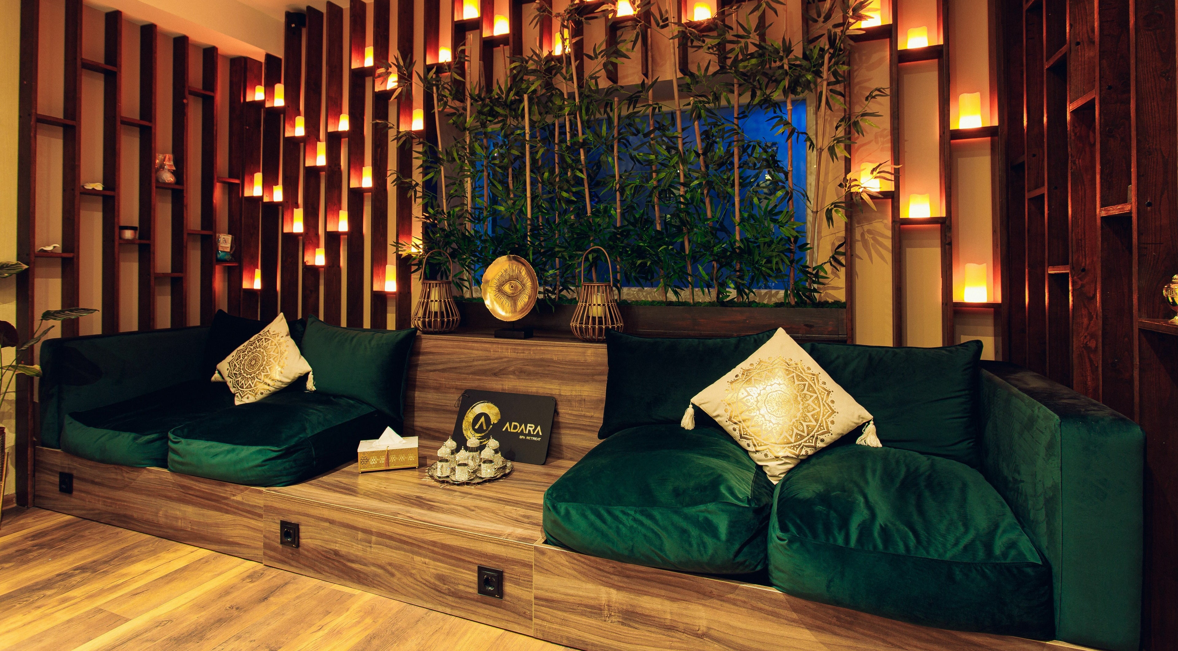 Elegant lounge area at Adara Spa, București, RO, with plush seating and ambient lighting.