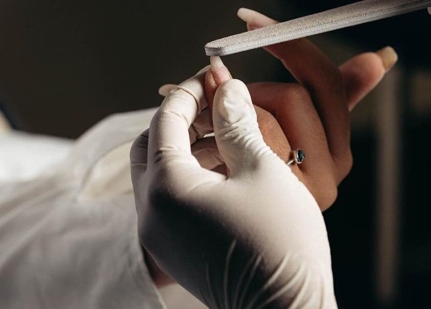 Expert nail filing by Auva Nails Home Service in Abu Dhabi, AE, showcasing premium manicure care.