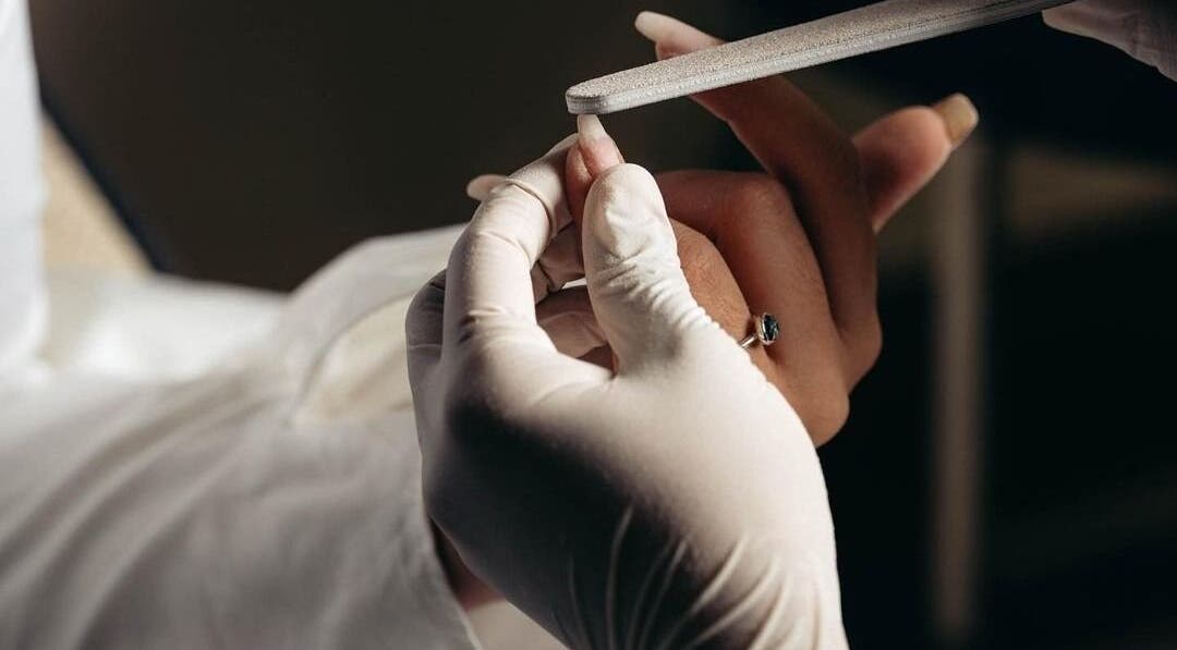 Expert nail filing by Auva Nails Home Service in Abu Dhabi, AE, showcasing premium manicure care.