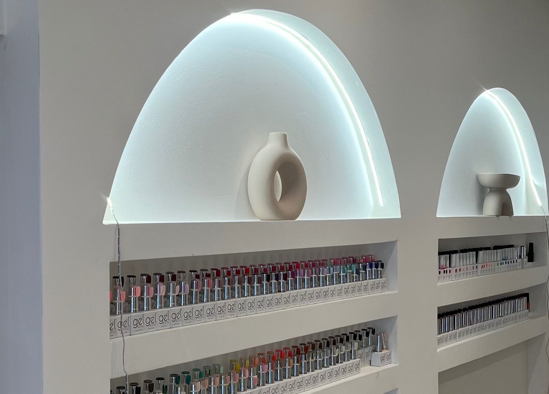 Elegant nail polish display at Pure Indulgence in Great Sankey, England, GB, featuring modern decor.