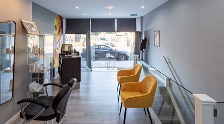 Modern interior of The House of Massage, London, England, GB showcasing sleek seating and serene ambiance.