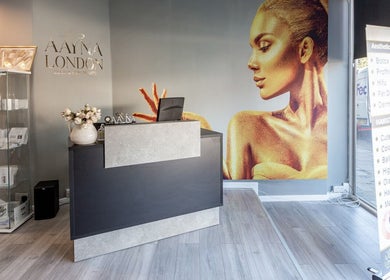 Reception area of The House of Massage, London, England, GB, featuring elegant decor and a modern counter.