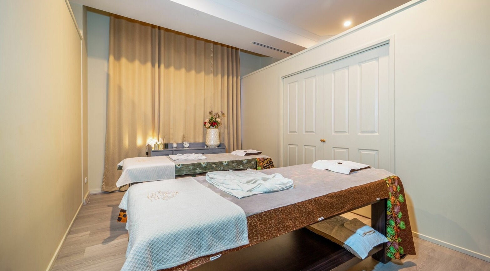 Tranquil spa room at Cantik Spa at the Grace Hotel, Sydney, New South Wales, AU with two massage beds.