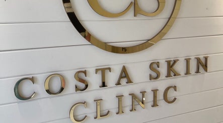 Elegant Costa Skin Clinic signage at Alnwick, England, GB, showcasing a sleek modern design.