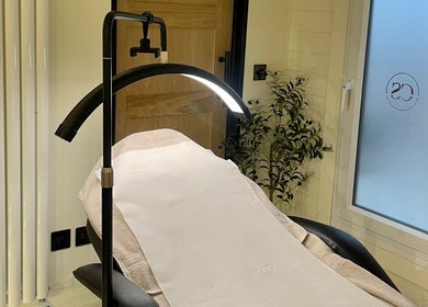 Calming treatment room at Costa Skin Clinic, Alnwick, England, GB, featuring massage table and ambient lighting.