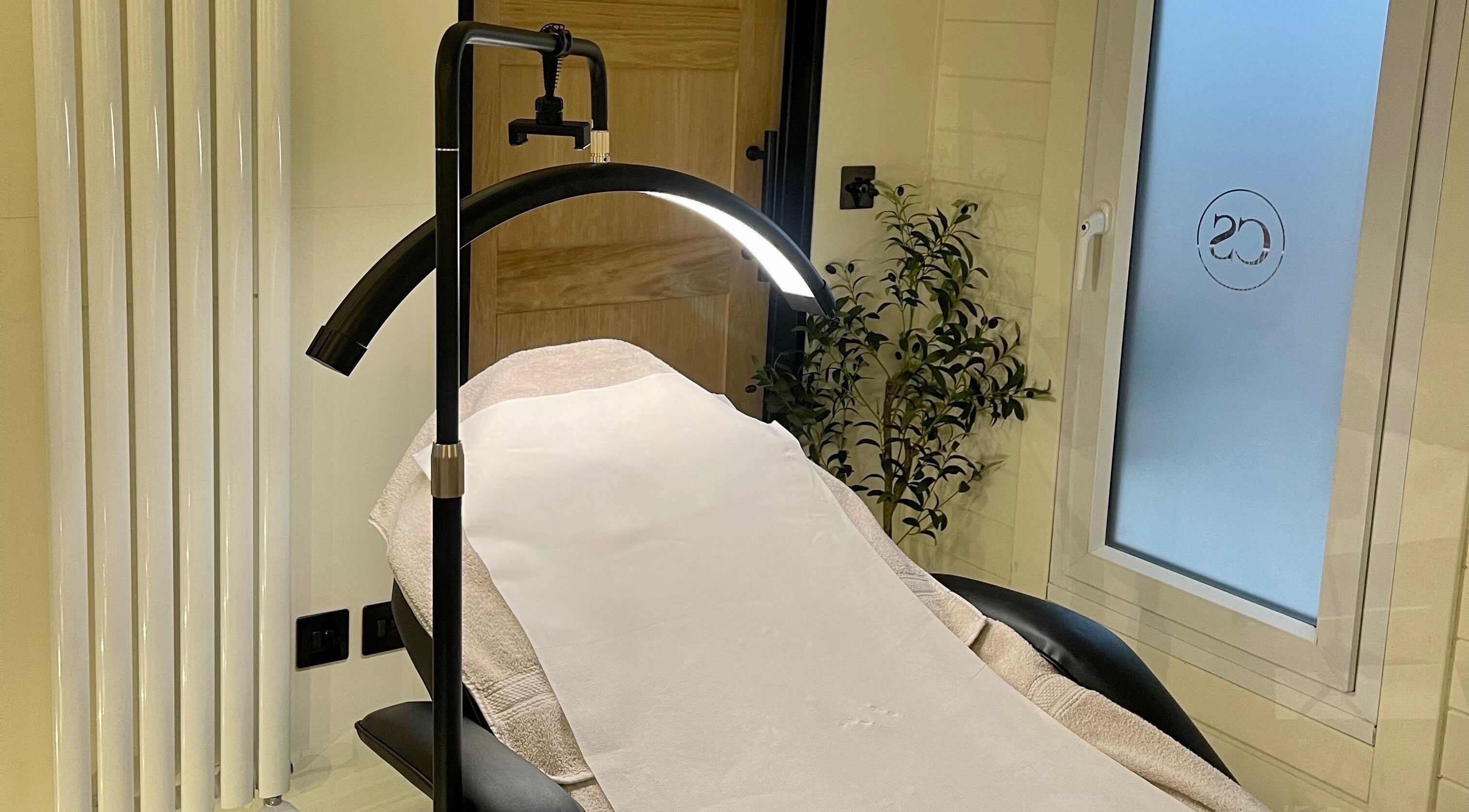 Calming treatment room at Costa Skin Clinic, Alnwick, England, GB, featuring massage table and ambient lighting.