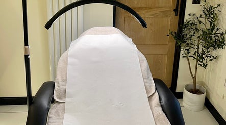 Treatment chair at Costa Skin Clinic, Alnwick, England, GB, with a serene light and decor.
