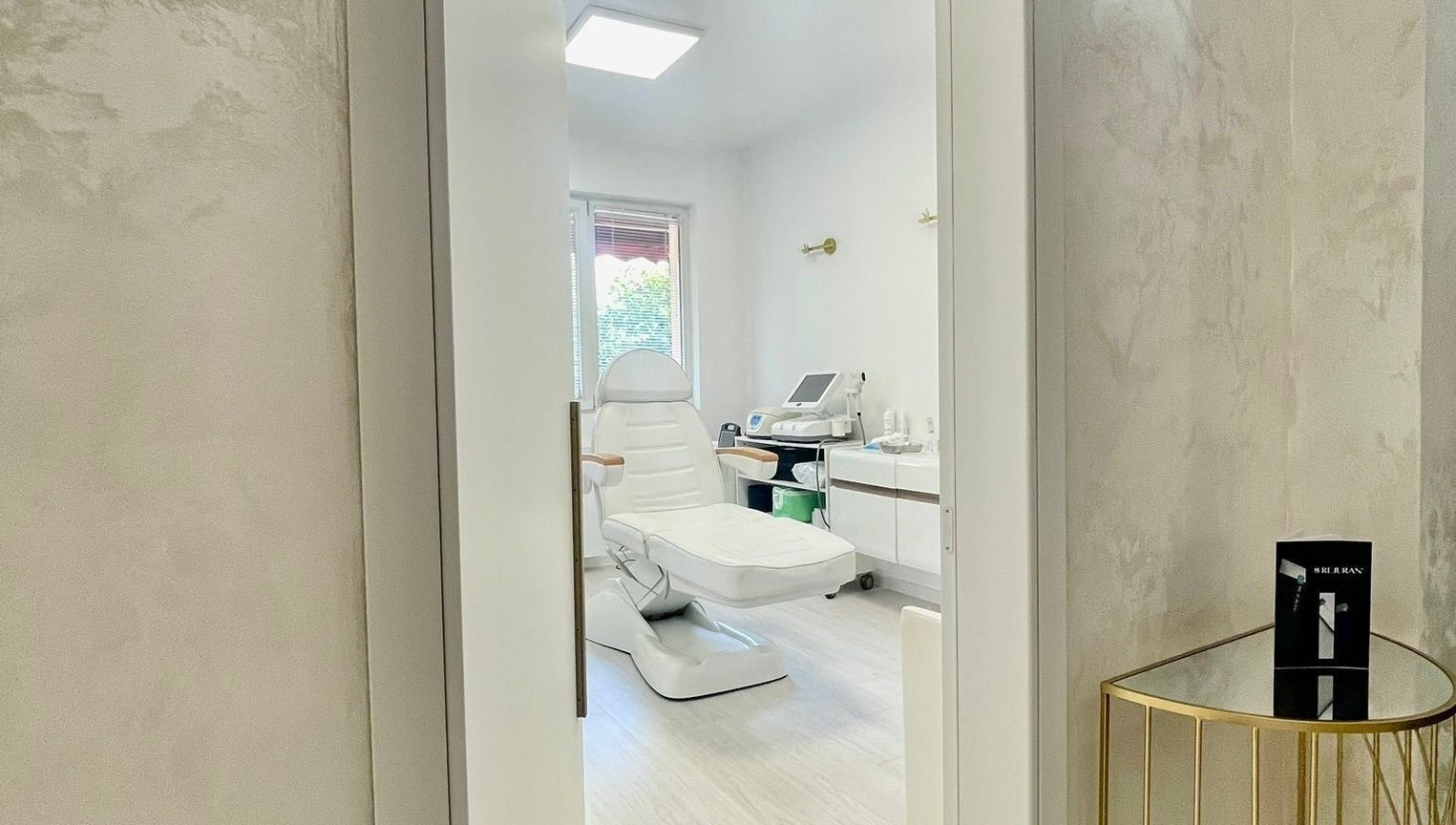 Dermalife Bulgaria treatment room in Sofia City Province, BG, featuring a modern white spa chair and equipment.