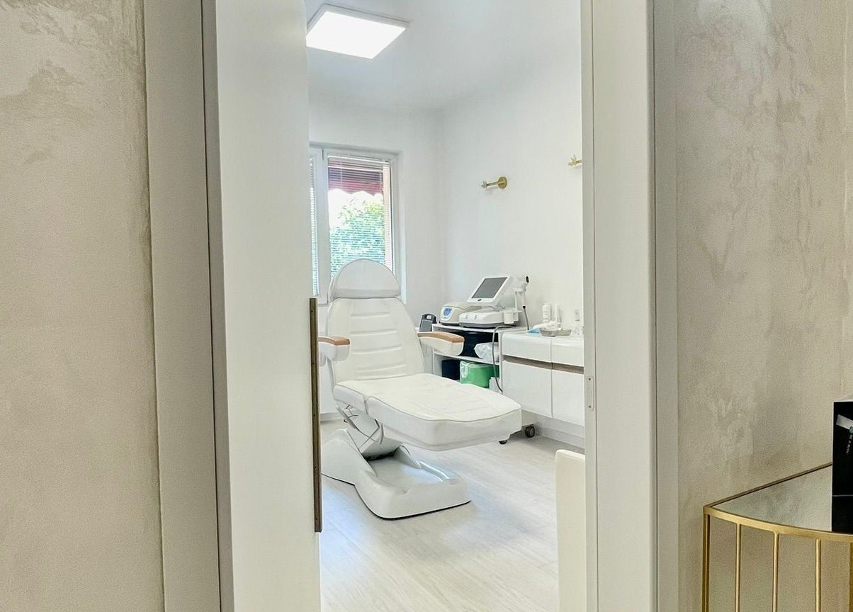 Dermalife Bulgaria treatment room in Sofia City Province, BG, featuring a modern white spa chair and equipment.