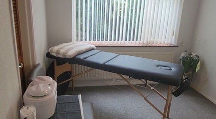 Comfortable massage table in tranquil room at Sugar and Beauty, Antrim, Northern Ireland, GB.