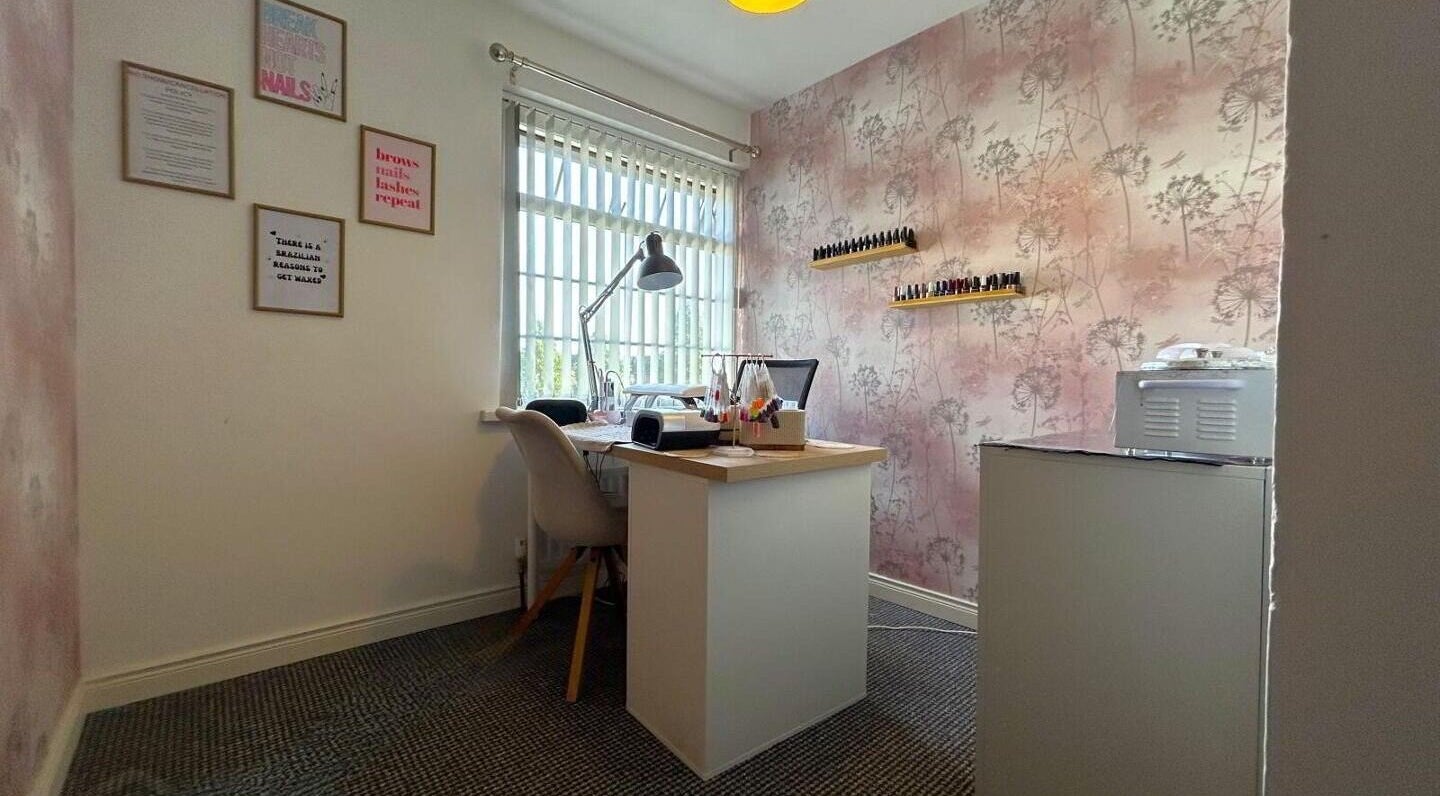 Nail art station at Sugar and Beauty in Antrim, Northern Ireland, GB with elegant decor and vibrant polish display.