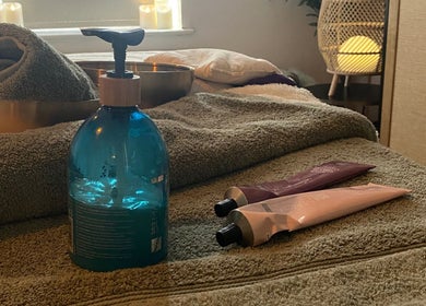 Relaxing spa essentials at Serene Holistics And Beauty in Shrewsbury, England, GB featuring towels and oils.
