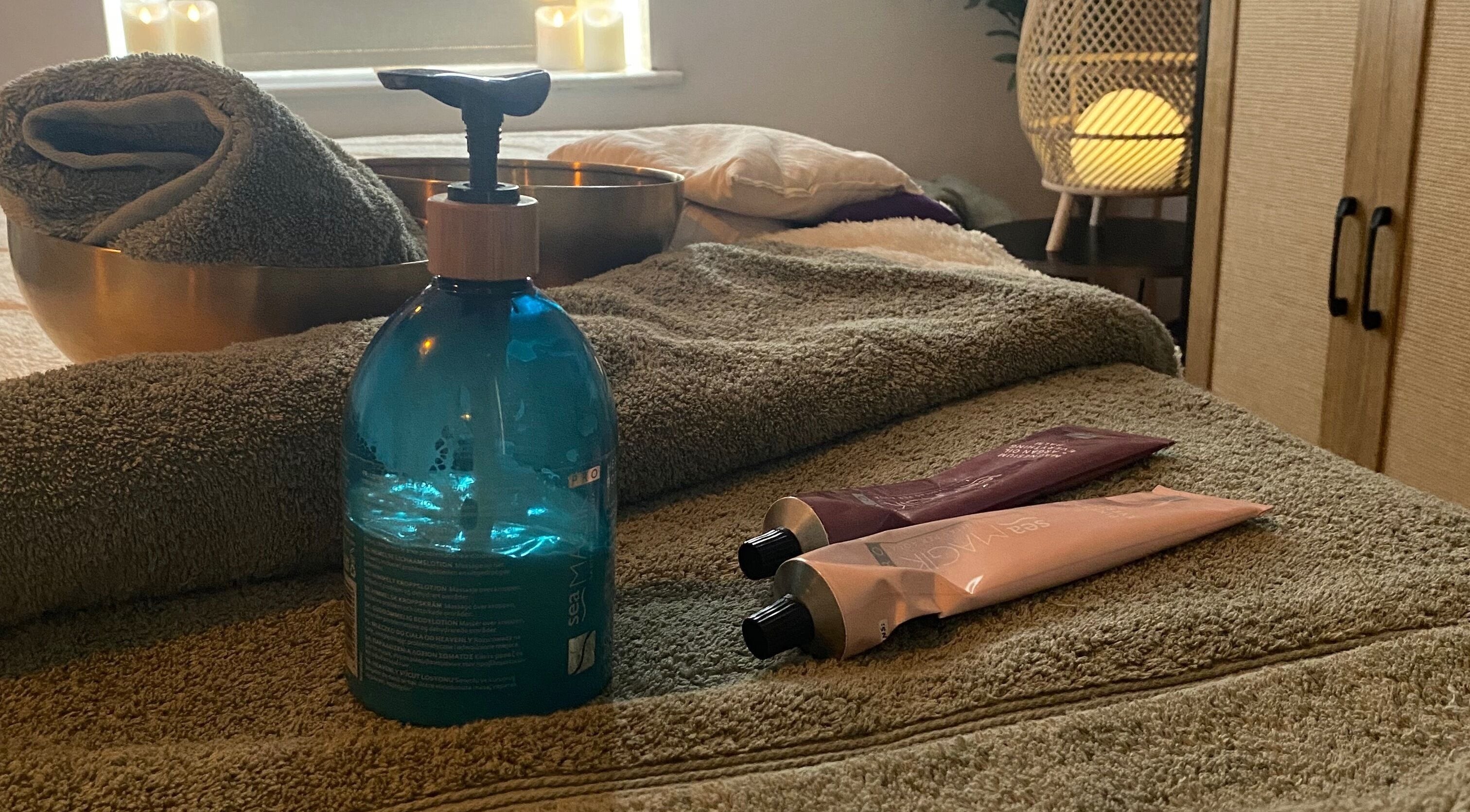 Relaxing spa essentials at Serene Holistics And Beauty in Shrewsbury, England, GB featuring towels and oils.
