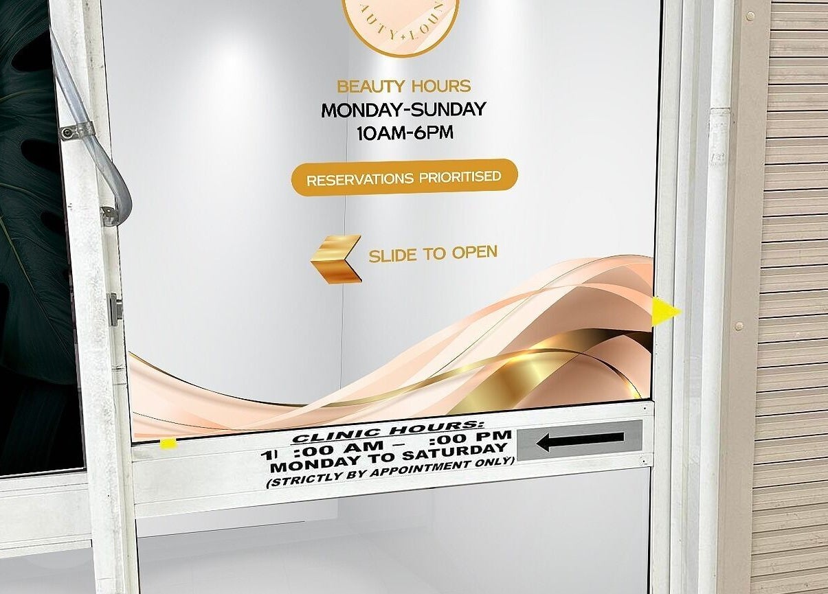 Entrance door of Sg Lounge in Blacktown, New South Wales, AU, with business hours displayed.