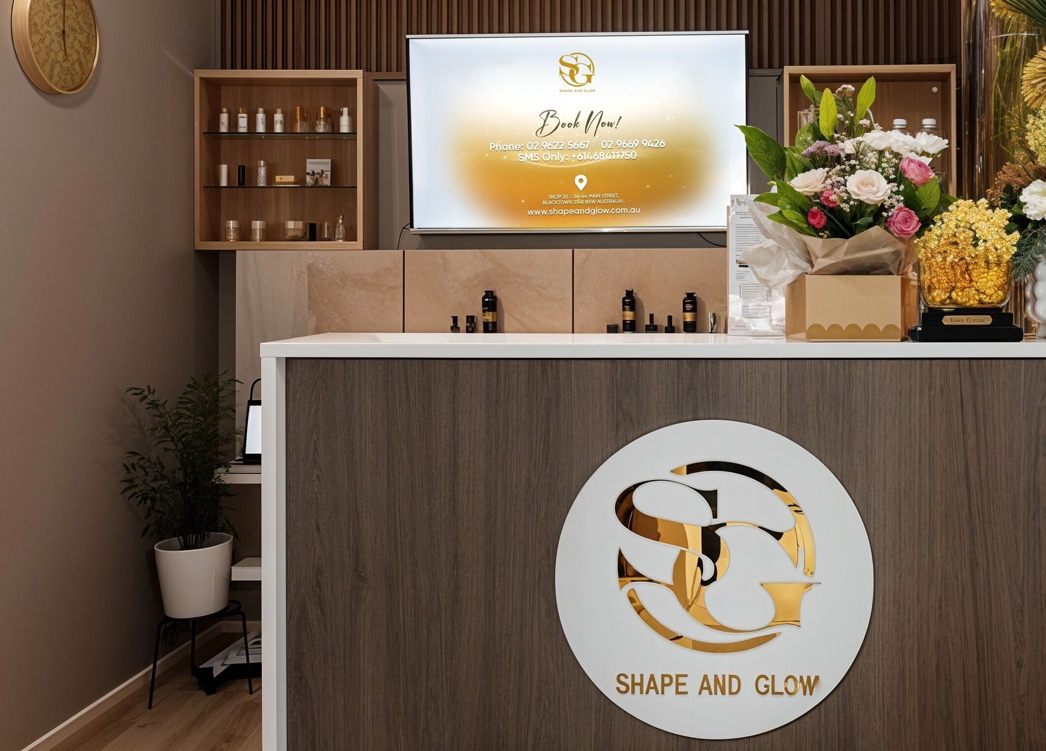 Reception at Shape and Glow, Blacktown, NSW, AU, featuring sleek design and floral decor.