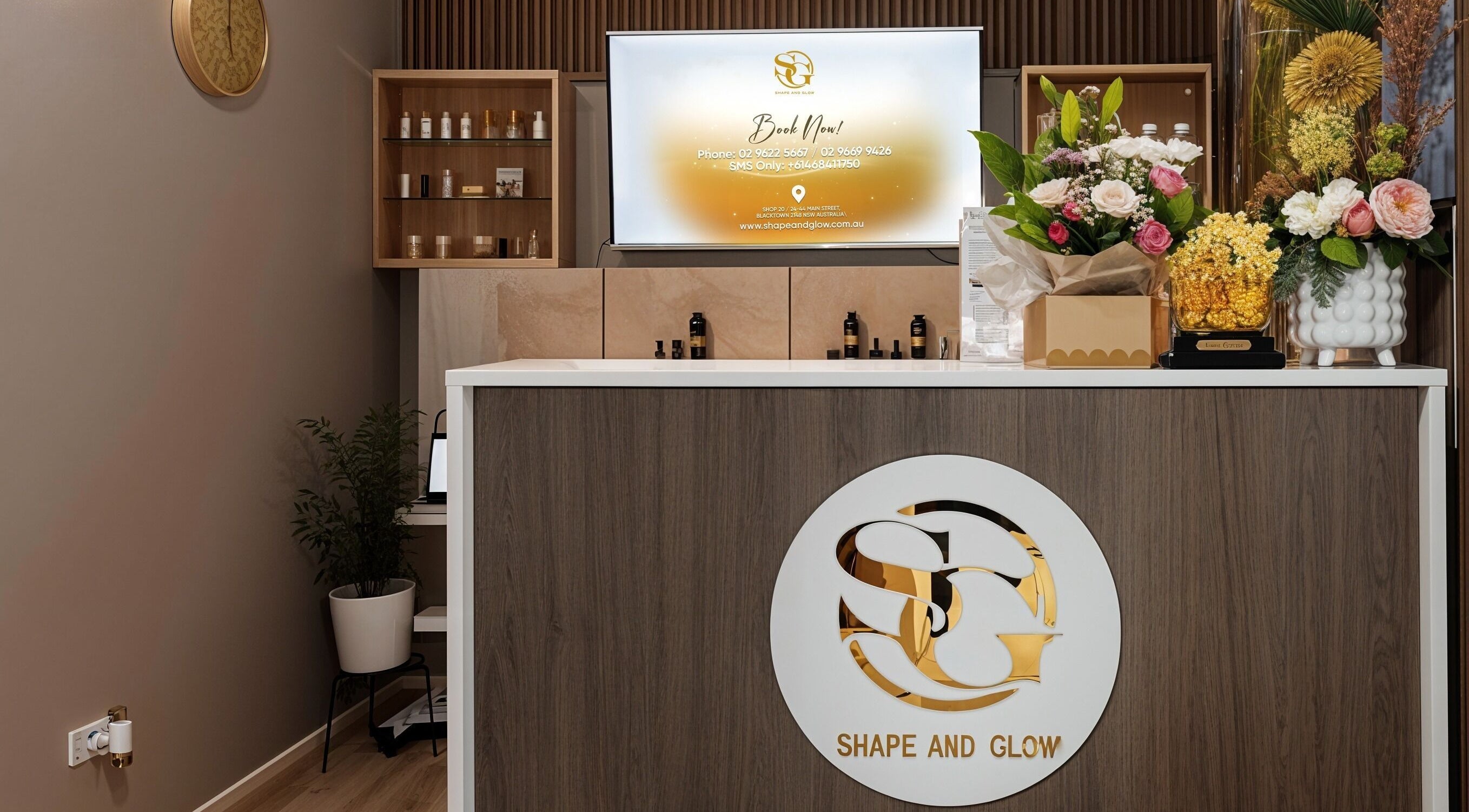 Reception at Shape and Glow, Blacktown, NSW, AU, featuring sleek design and floral decor.