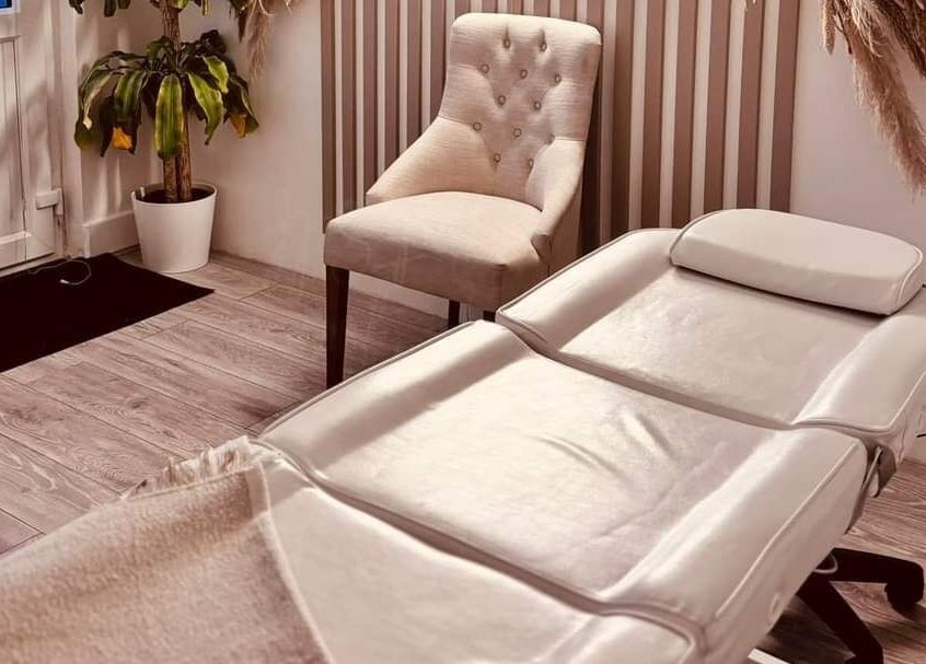 Luxurious treatment room at Belle Moi Beauty, Sutton-in-Ashfield, England, GB, with a plush chair and massage table.