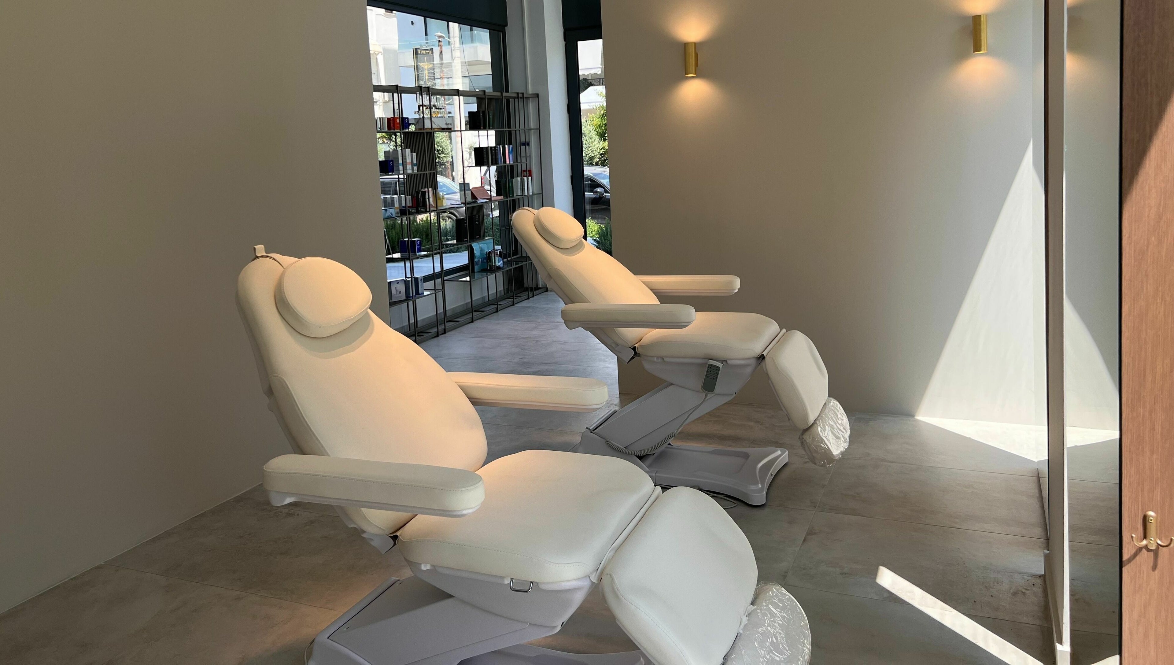 Luxurious treatment chairs at Face It Mind Skin Bar, Glifada, GR, offering a relaxing ambiance.