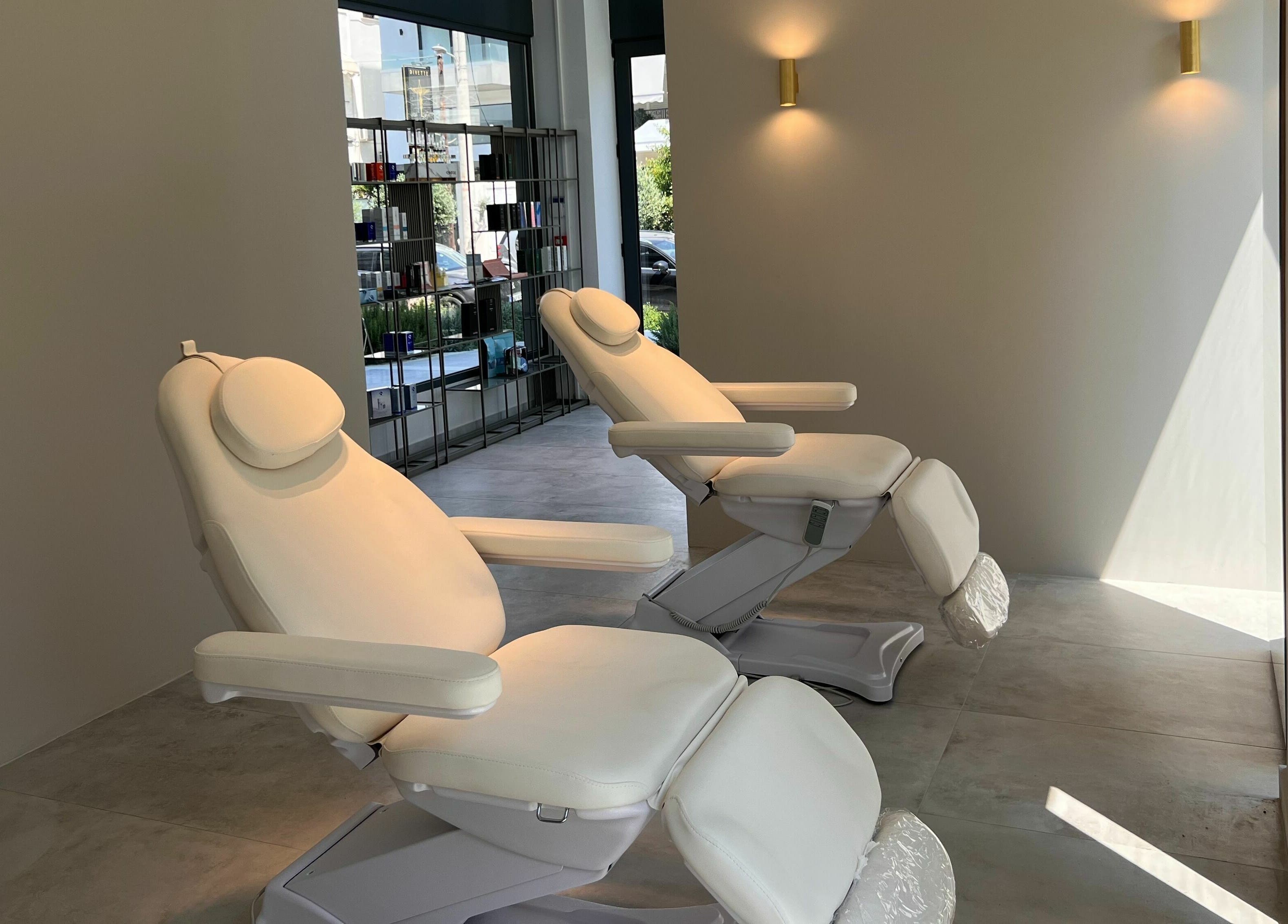 Luxurious treatment chairs at Face It Mind Skin Bar, Glifada, GR, offering a relaxing ambiance.