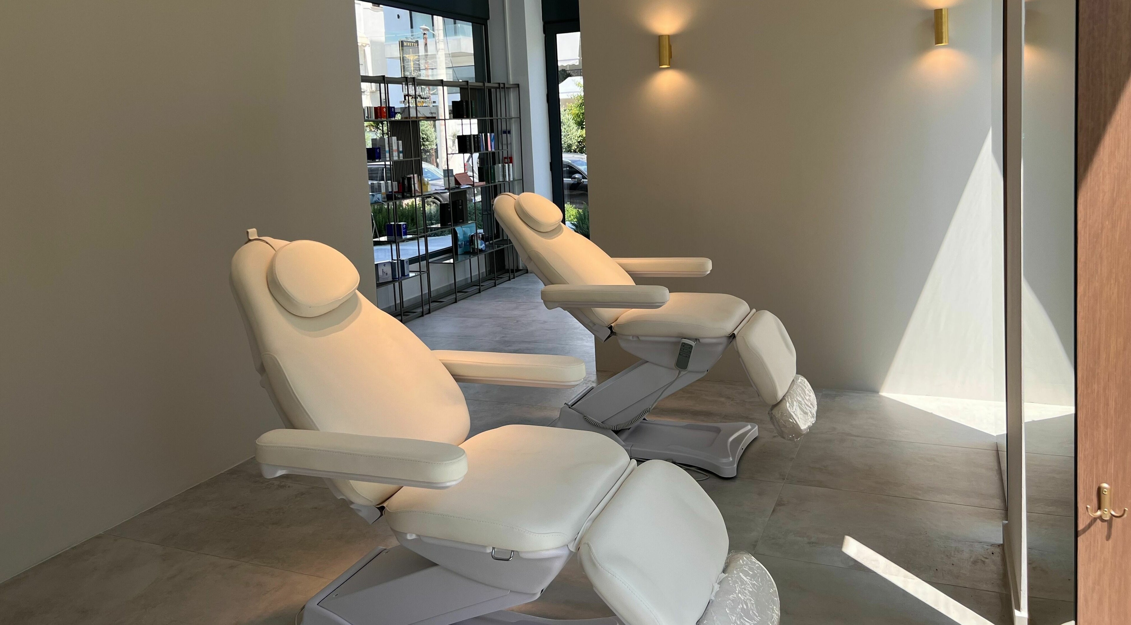Luxurious treatment chairs at Face It Mind Skin Bar, Glifada, GR, offering a relaxing ambiance.