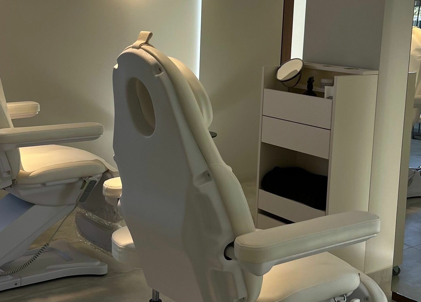 Modern treatment chairs inside Face It Mind Skin Bar, Glifada, GR, showcasing a serene atmosphere.