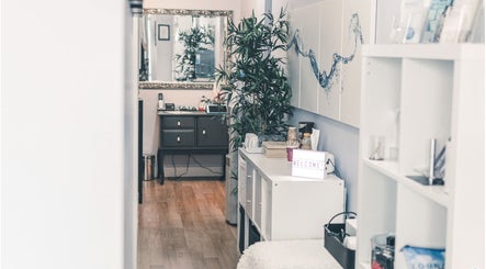 Relaxing interior of Spa at the Madison in Burnaby, British Columbia, CA, featuring cozy decor and welcoming sign.