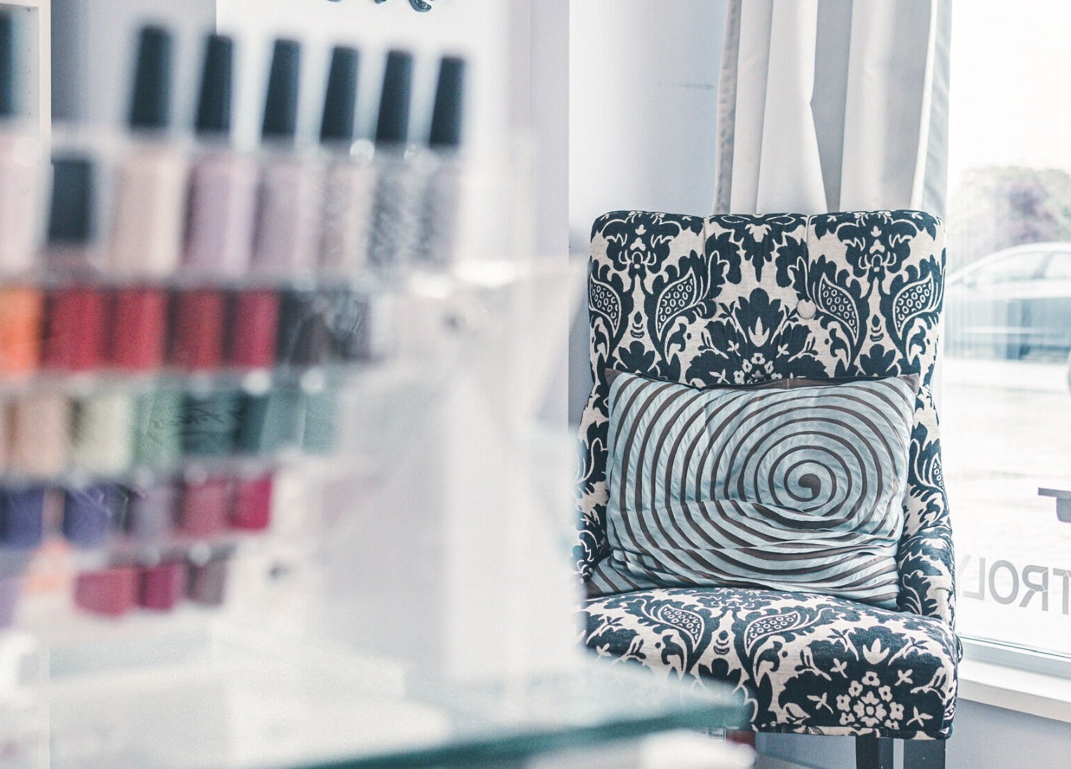 Elegant chair with nail polishes at Spa at the Madison, Burnaby, BC, CA invites relaxation.