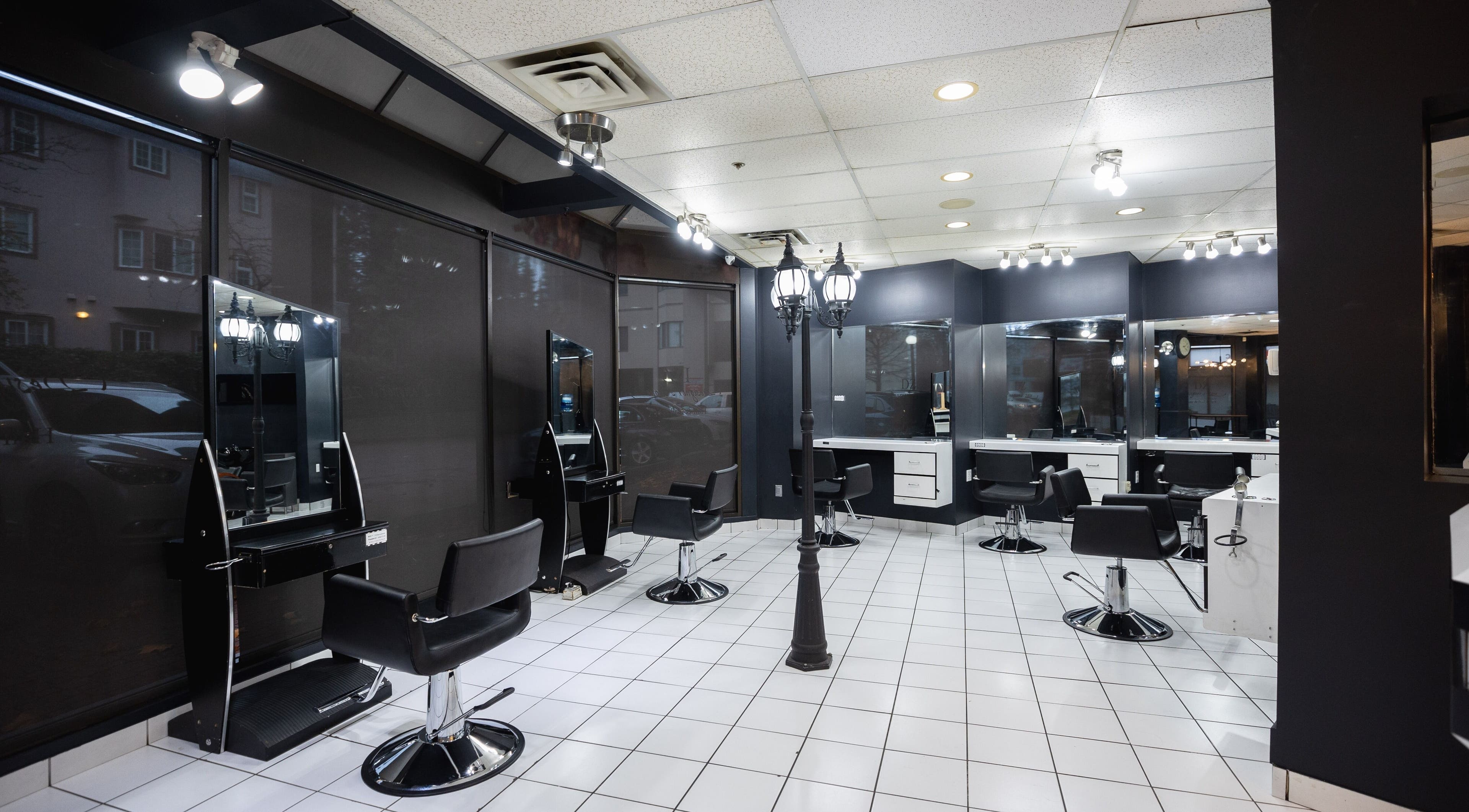Chic interior of DZ Hair Salon in Burnaby, British Columbia, CA, featuring modern styling chairs and mirrors.