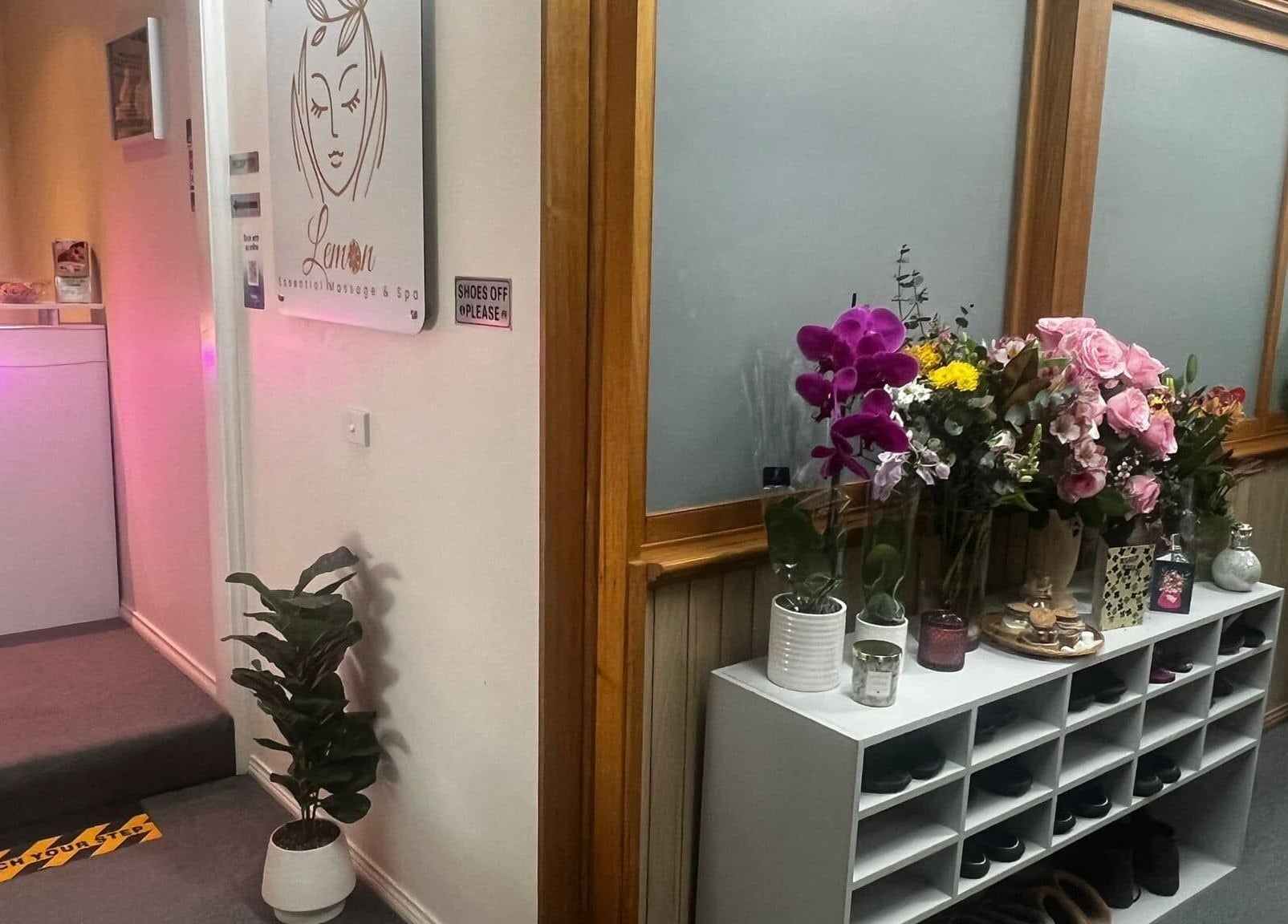 Entrance of Lemon Essential Massage & Spa Shepparton, Victoria, AU with flowers and signage.