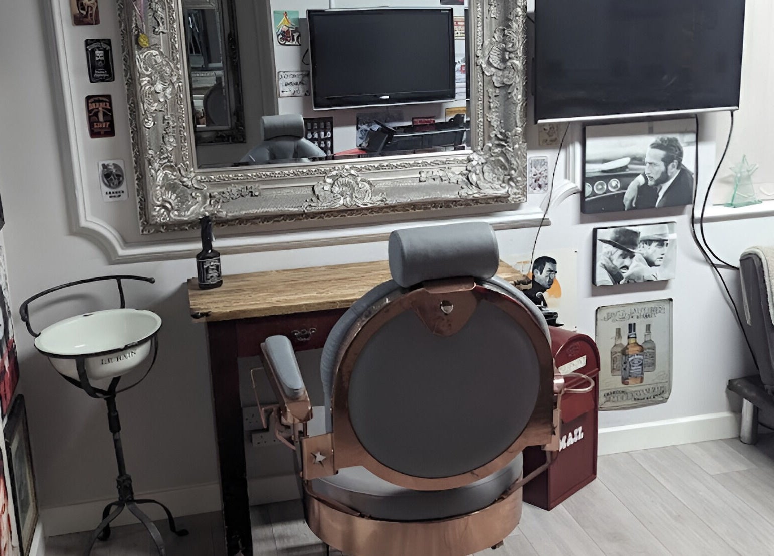 Vintage barber chair in Fred's Barbers, Crawley, England, GB with ornate mirror and classic decor.