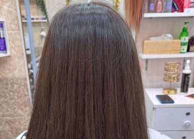 Smooth, straightened hair styled at Moon Valley Shine Spa - Home Service in Dubai, AE.