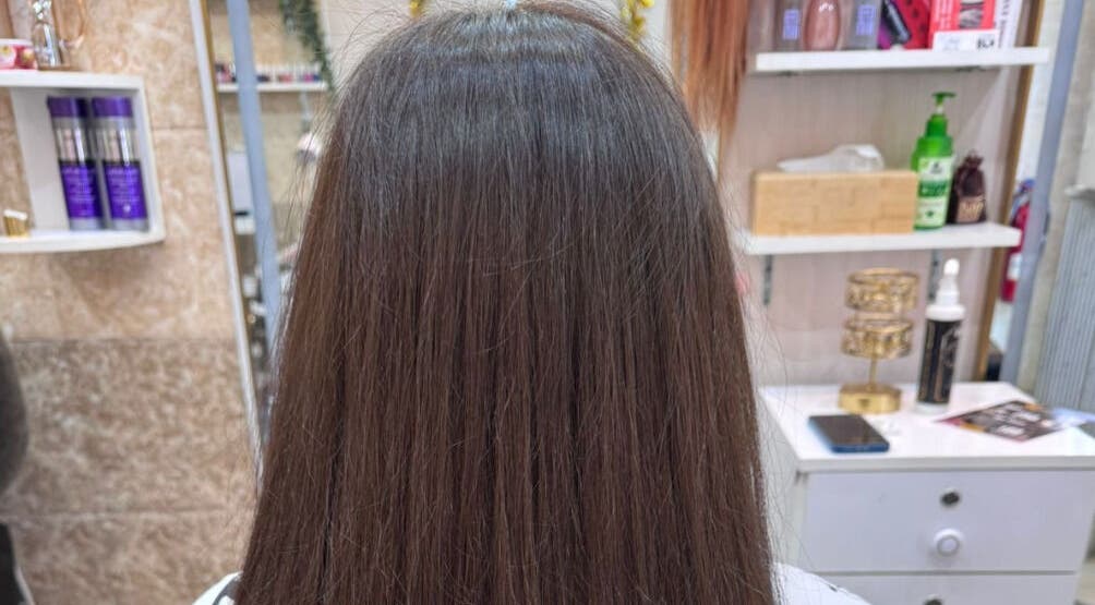 Smooth, straightened hair styled at Moon Valley Shine Spa - Home Service in Dubai, AE.