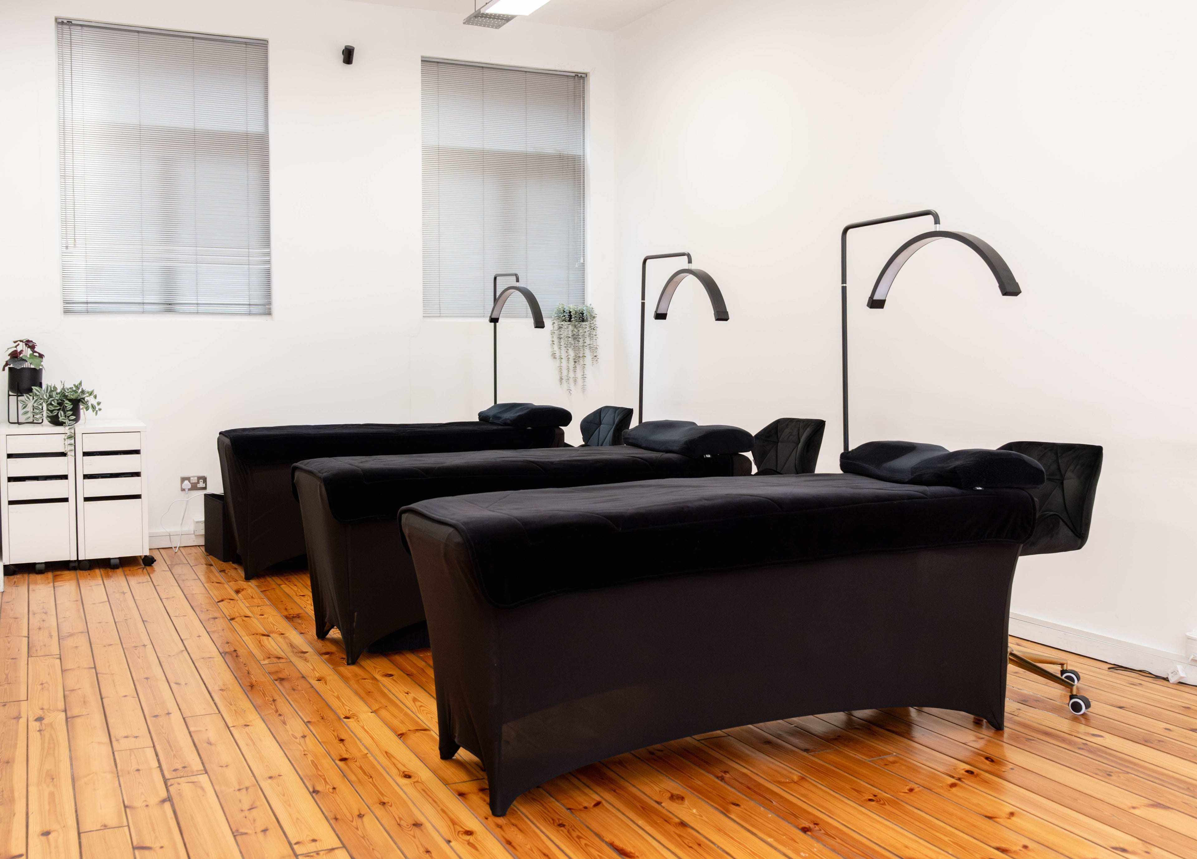 Polly Lashes & Brows London, sleek treatment room with plush black chairs in London, England, GB.