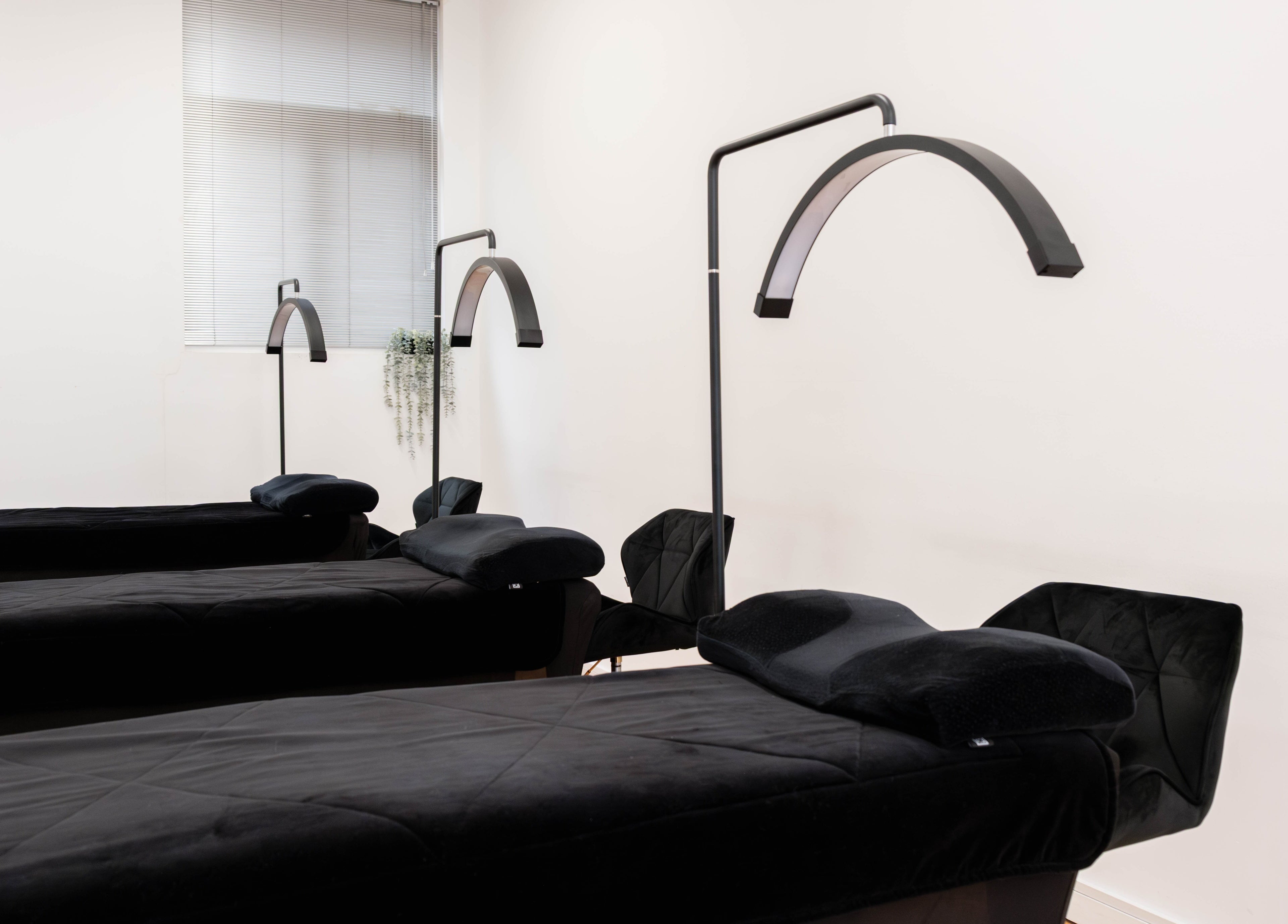 Luxury treatment beds at Polly Lashes & Brows London, located in London, England, GB, offering comfort and style.