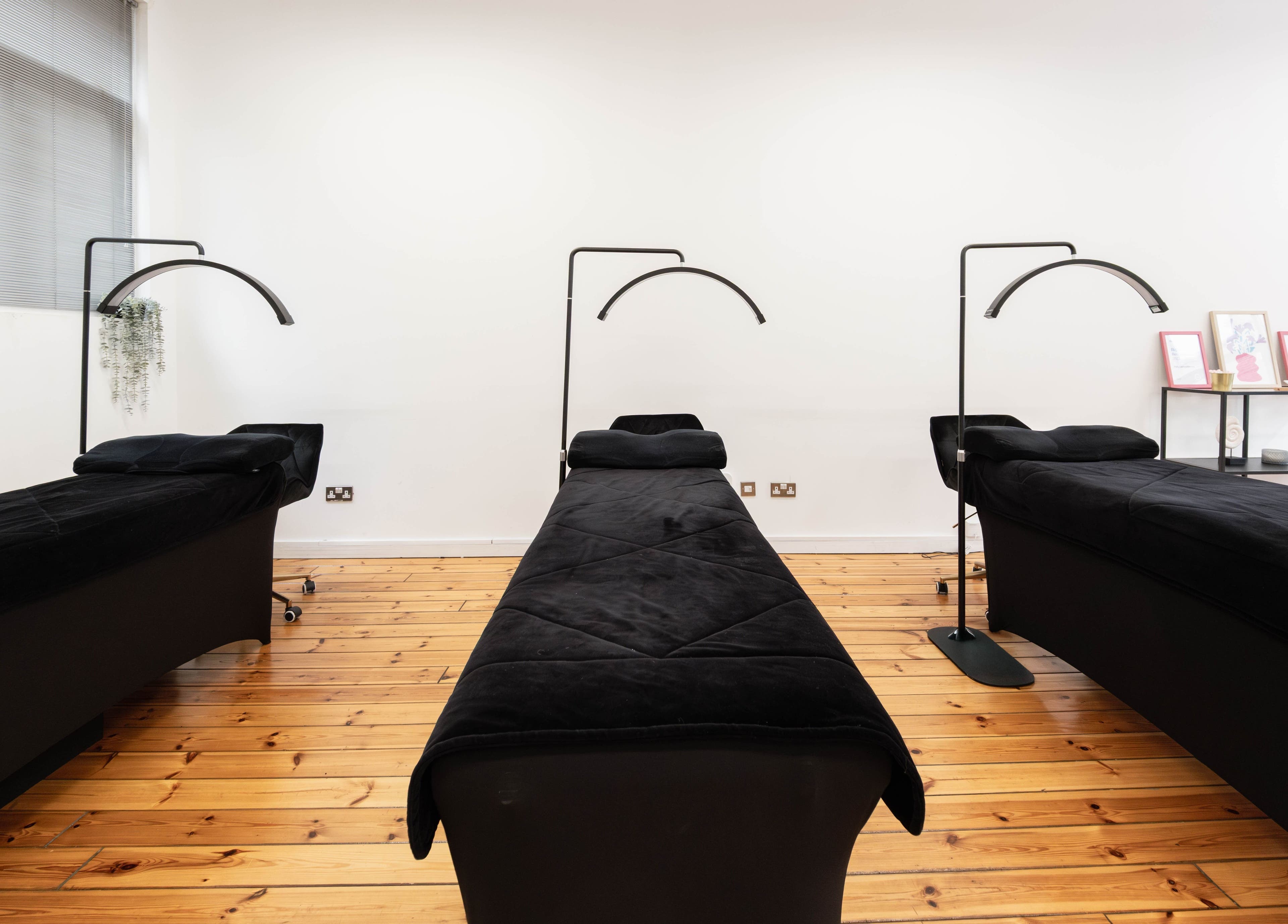 Polly Lashes & Brows London treatment room with elegant black beds. Located in London, England, GB.