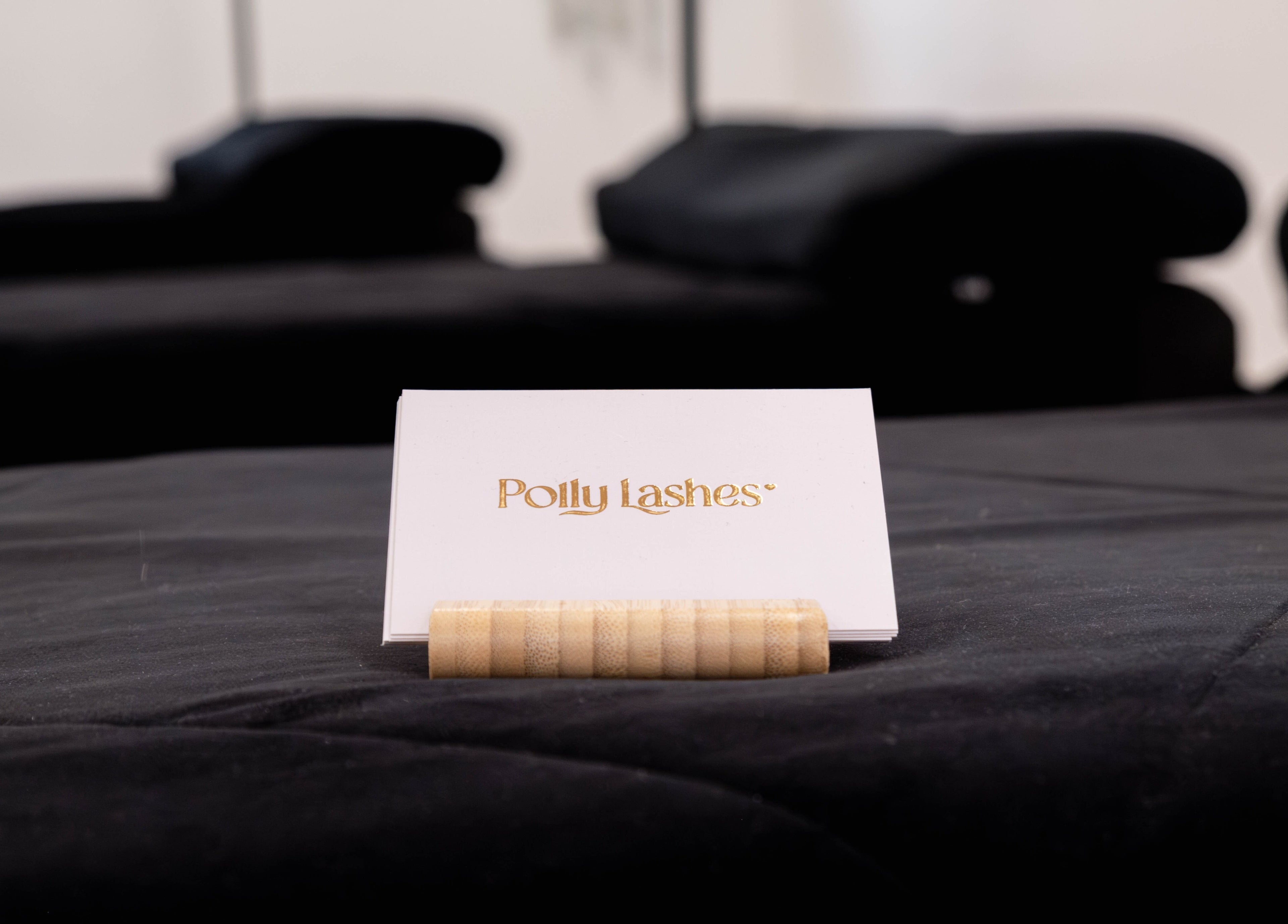 Polly Lashes & Brows London card on display in a chic setting, London, England, GB.