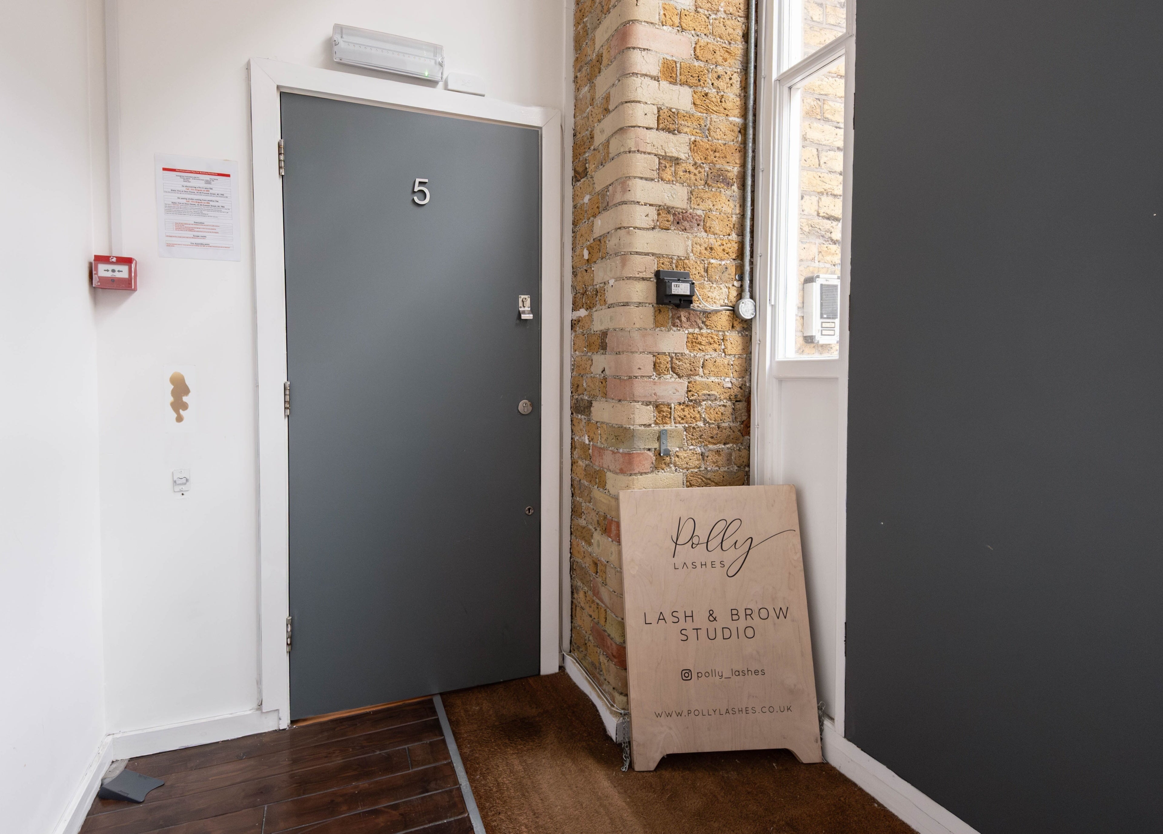 Entrance of Polly Lashes & Brows London in London, England, GB, featuring a stylish interior design.