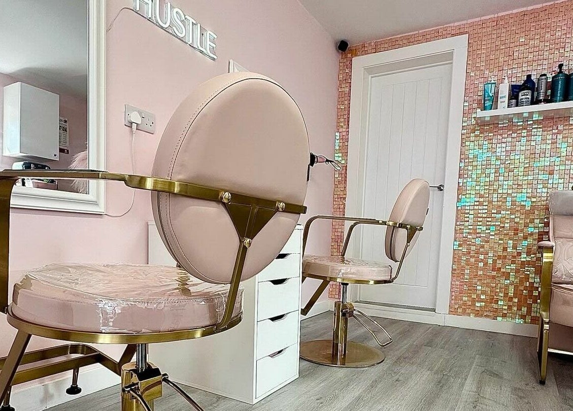 Lux Locks by Edie salon chairs in stylish pink interior, Bexhill, England, GB.