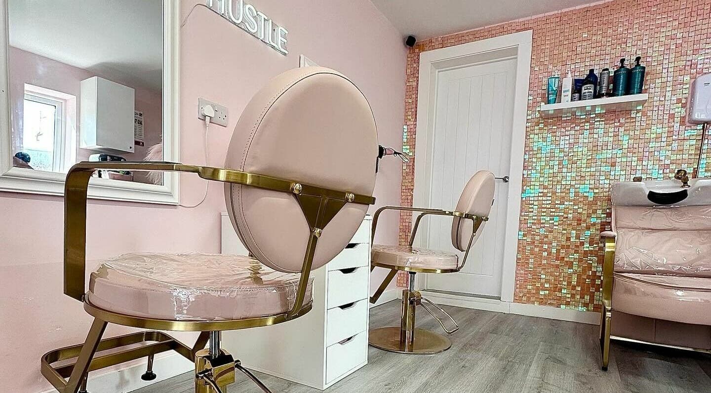 Lux Locks by Edie salon chairs in stylish pink interior, Bexhill, England, GB.