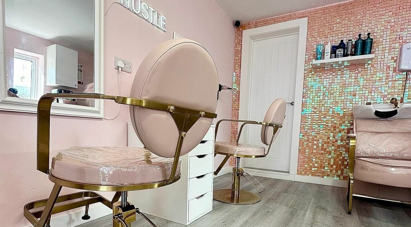 Lux Locks by Edie salon chairs in stylish pink interior, Bexhill, England, GB.