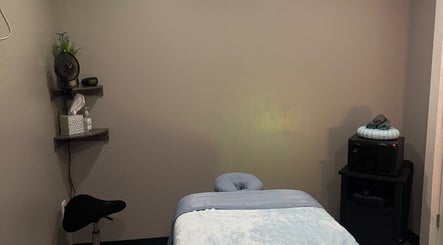 Massage room at Kingston Body Wellness, Kingston, Georgia, US, featuring a massage table and calming decor.