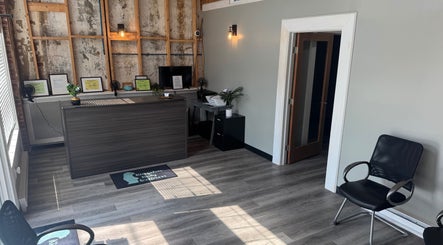 Reception area of Kingston Body Wellness in Kingston, Georgia, US, featuring modern decor and seating.