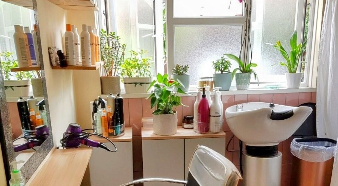 Bright hair salon with plants at Hair by Elena P, London, England, GB.